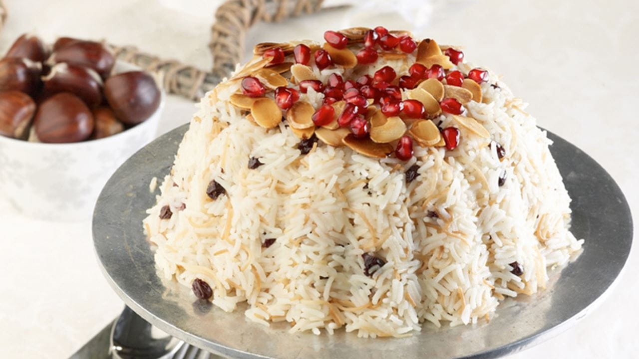 recipe image Ριζότο με καβουρδισμένο φιδέ, ξηρούς καρπούς και ρόδι